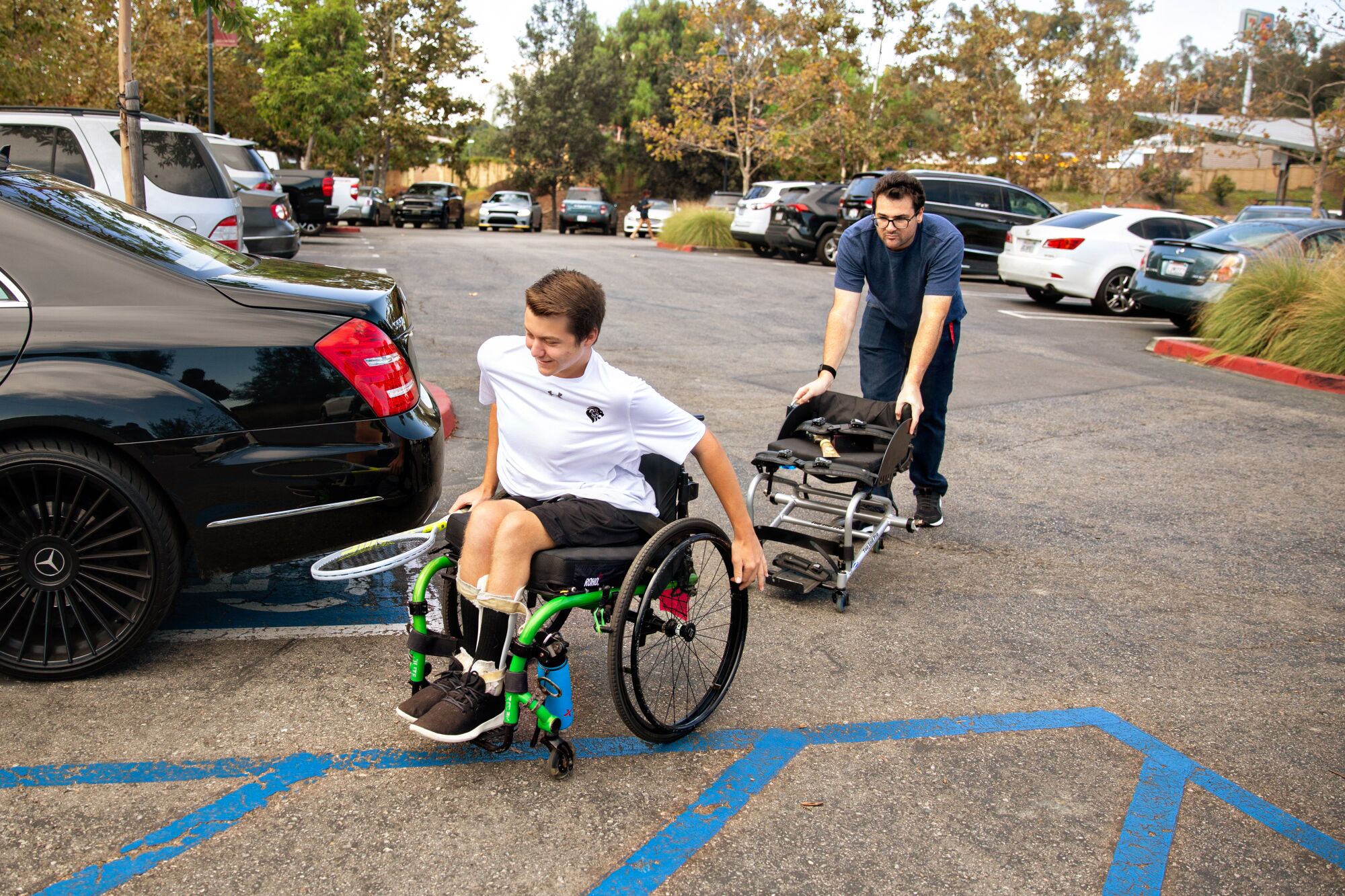 Landon Sachs arrives for tennis practice along with his brother Myles at JSerra High School.