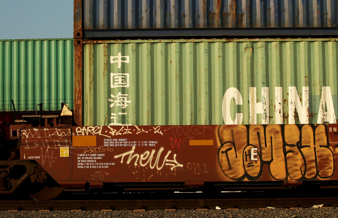 Freight containers move by rail through the port of Los Angeles