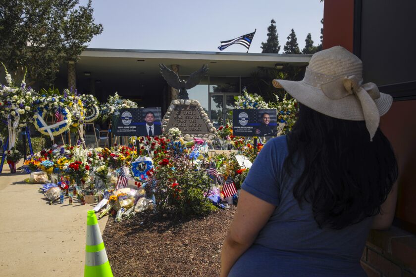 El Monte, CA - June 16: A memorial for two dead El Monte police officers grew huge at El Monte Police Department at Civic Center on Thursday, June 16, 2022 in El Monte, CA. (Irfan Khan / Los Angeles Times)