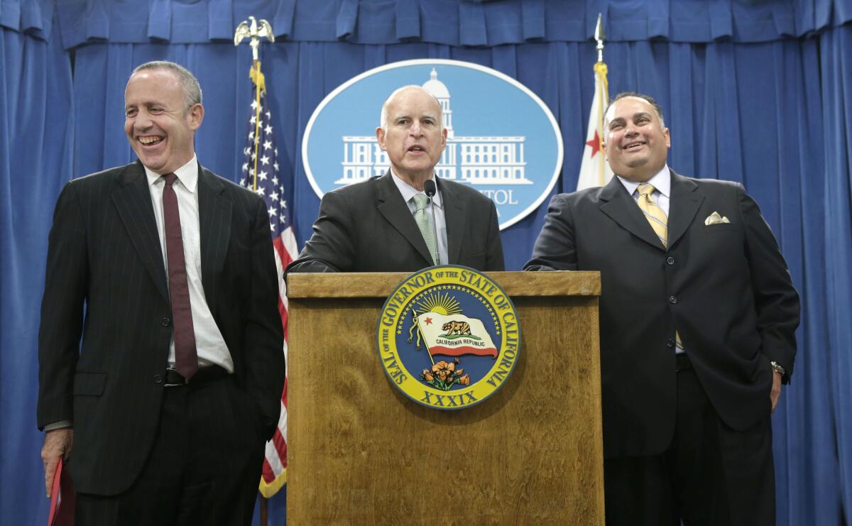Senate leader Darrell Steinberg (D-Sacramento), Gov. Jerry Brown and Assembly Speaker John A. Perez (D-Los Angeles) at a press conference in the Capitol on Tuesday.