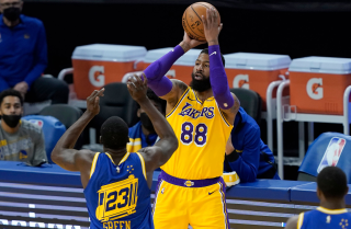 SAN FRANCISCO, CALIFORNIA - MARCH 15: Markieff Morris #88 of the Los Angeles Lakers shoots over Draymond Green.