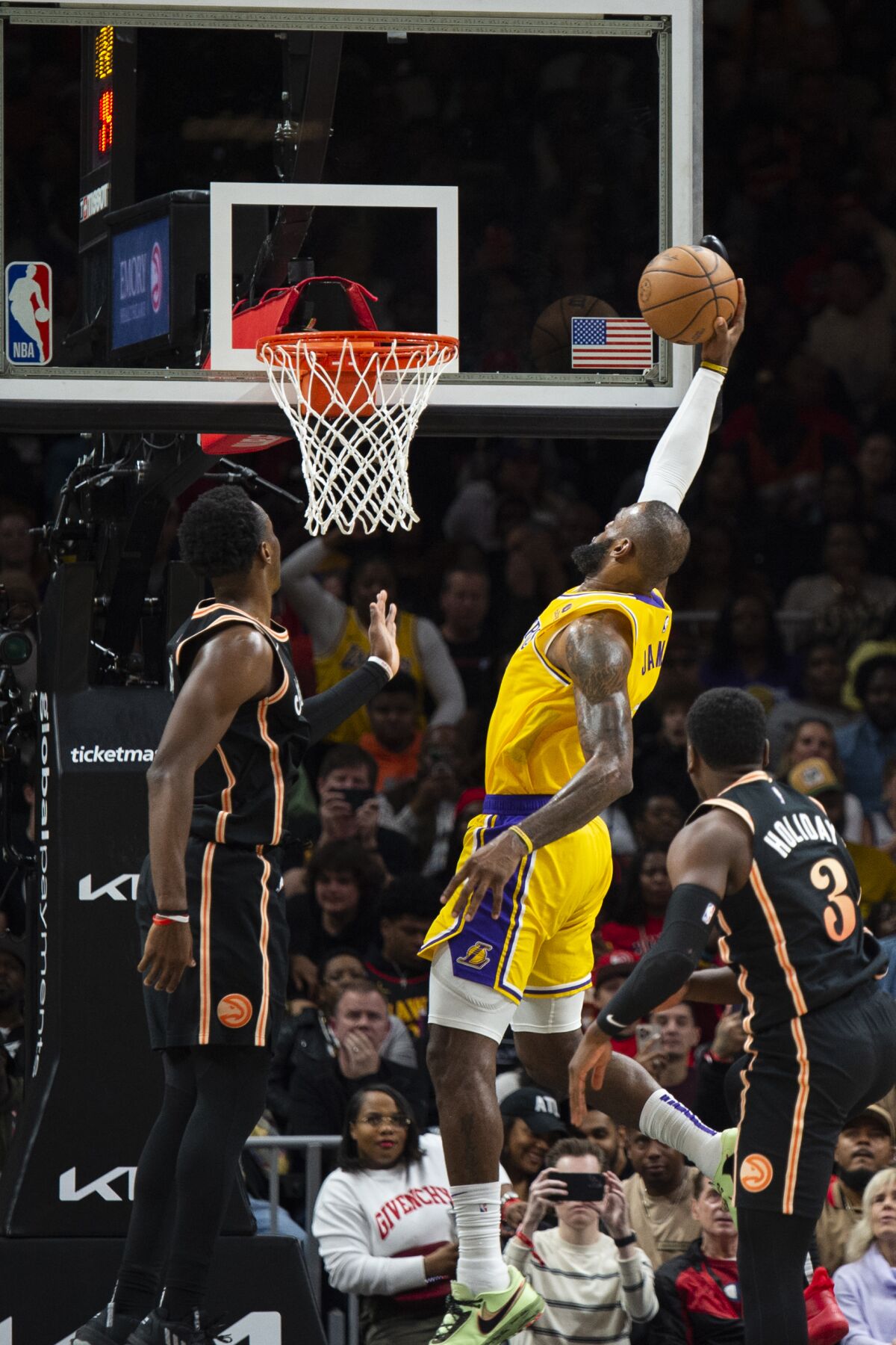 Lakers forward LeBron James dives against the Atlanta Hawks in the second half on December 30, 2022.