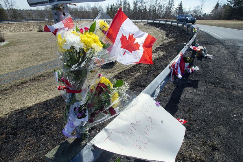 FILE - A memorial pays tribute to Royal Canadian Mounted Police Constable Heidi Stevenson, a mother of two and a 23-year veteran of the force, along the highway in Shubenacadie, Nova Scotia, on Tuesday, April 21, 2020. A public inquiry has found widespread failures in how Canada’s federal police force responded to the country’s worst mass shooting, Thursday, March 30, 2023. It recommends that the government rethink the Royal Canadian Mounted Police’s central role in Canadian policing. (Andrew Vaughan/The Canadian Press via AP, File)