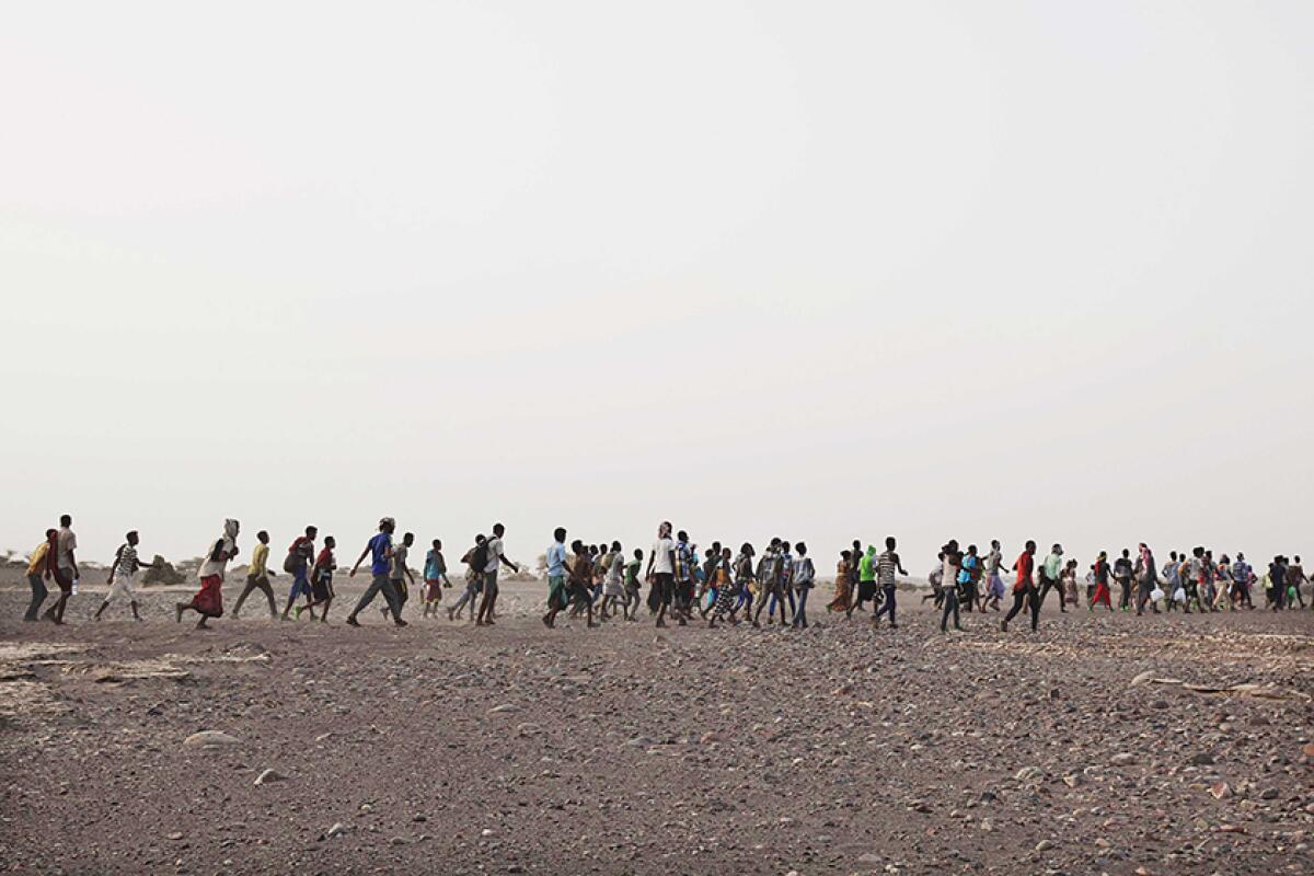 Smugglers lead Ethiopian migrants in Obock, Djibouti. 