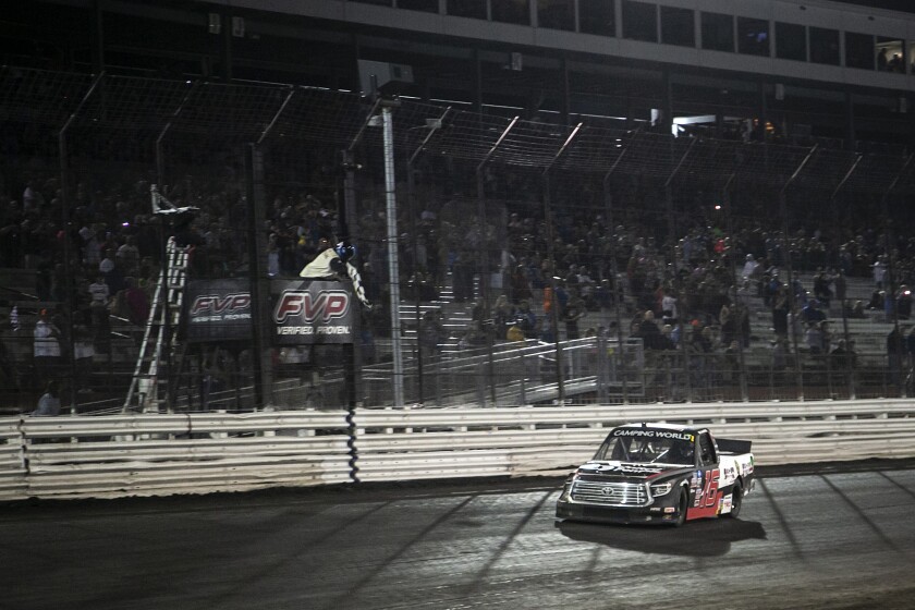 Austin Hill crosses the finish line to win the NASCAR Truck Series auto race Friday, July 9, 2021, at Knoxville Raceway in Knoxville, Iowa. (Joseph Cress/Iowa City Press-Citizen via AP)