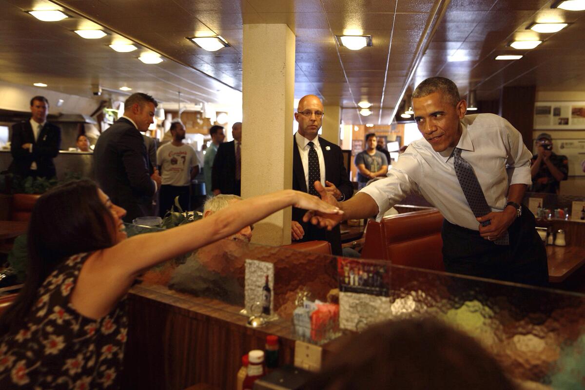 President Obama talks with diners at Canter's Deli in the Fairfax district of Los Angeles.