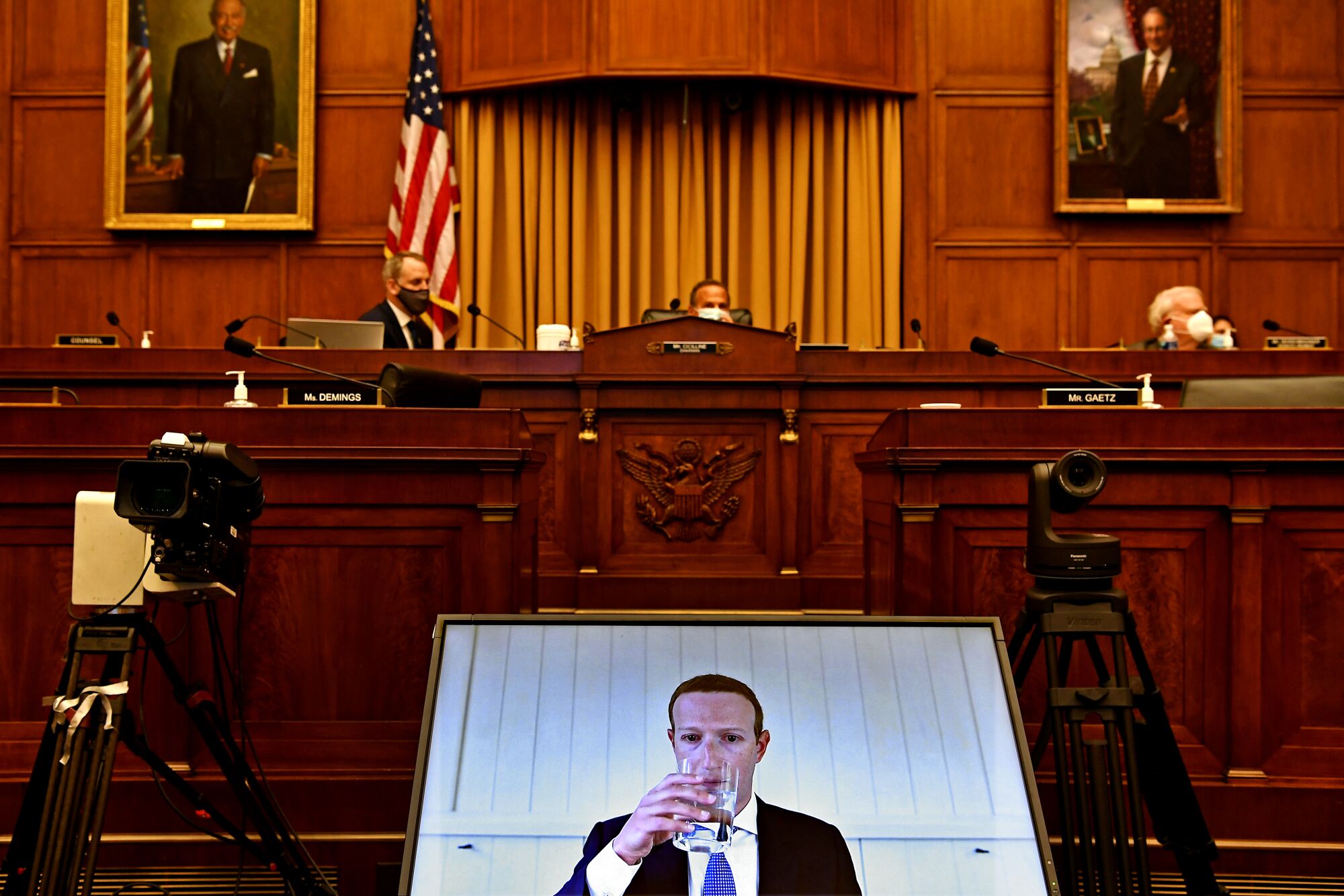 Facebook CEO Mark Zuckerberg is seen onscreen during remote testimony before House lawmakers on Capitol Hill.