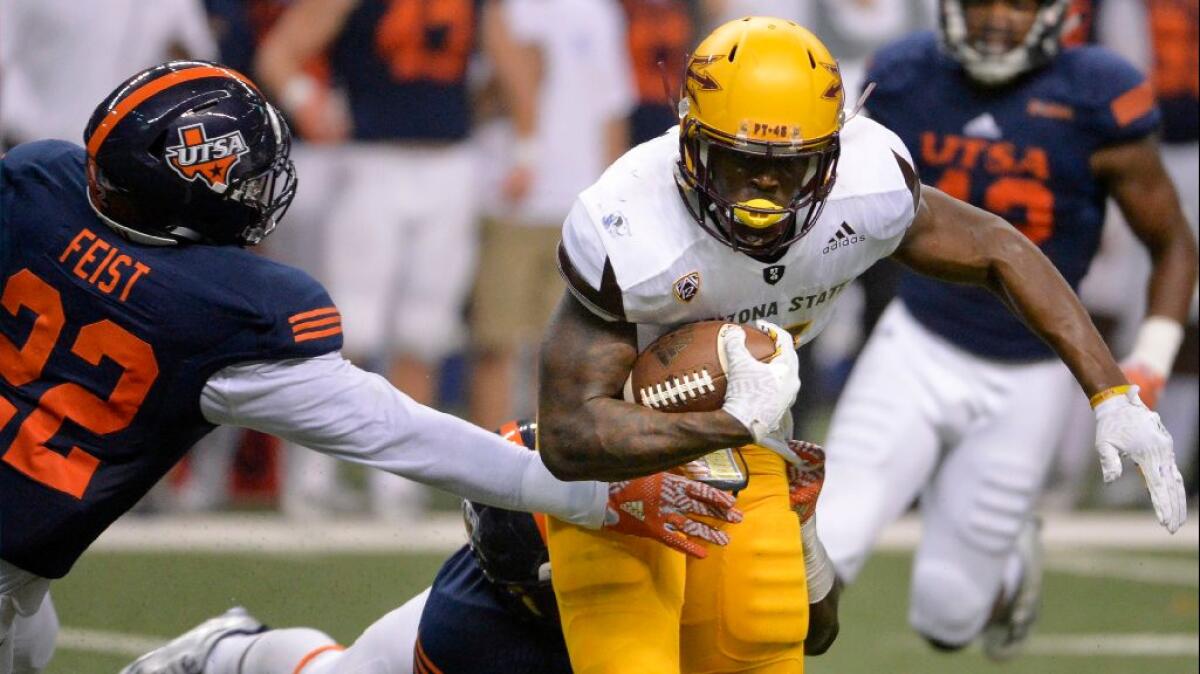 Arizona State running back Kalen Ballage is tackled during the Sun Devils' 32-28 victory over Texas San Antonio on Sept. 16.