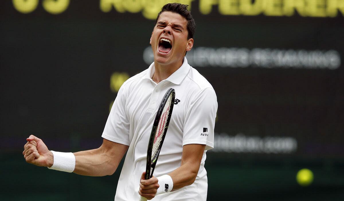 Milos Raonic celebrates after beating Roger Federer during the Wimbledon semifinals on Friday.