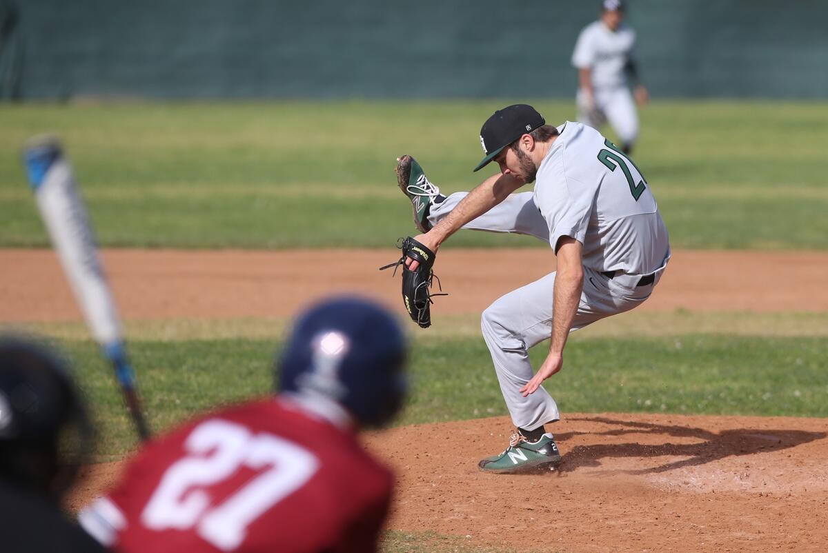 Sage Hill School starting pitcher Drake Mossman jumps out of the way of a line drive at his feet during a San Joaquin League game against St. Margaret's at San Juan Capistrano Sports Park on Tuesday.