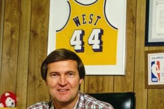 Jerry West, general manager of the Lakers, sits at his desk circa 1987 at the Forum.