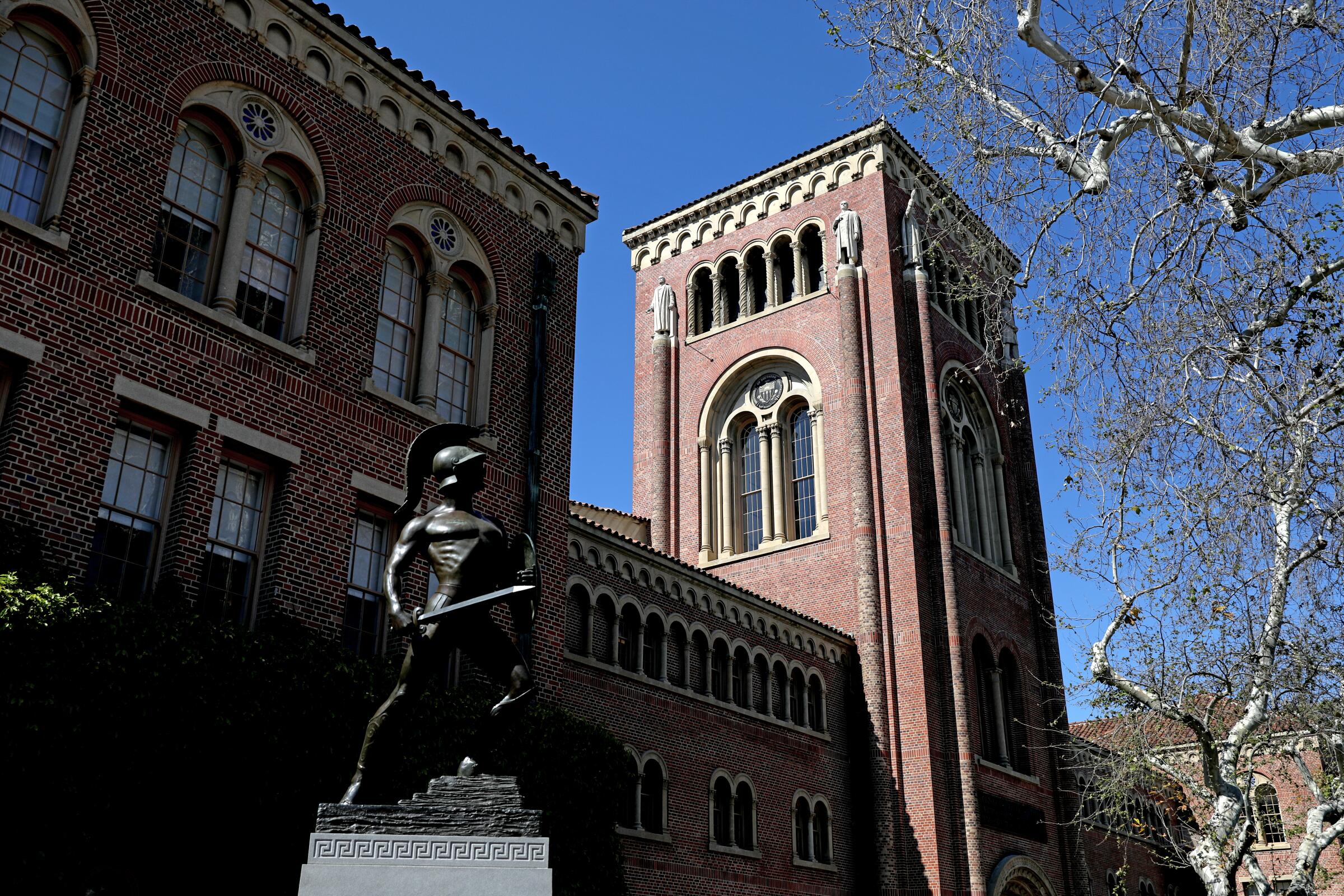 Bovard Administration Building with Tommy Trojan sculpture on the USC campus.