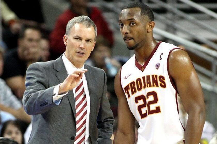 USC Coach Andy Enfield talks to guard Byron Wesley during a game against Cal State Northridge earlier this season.