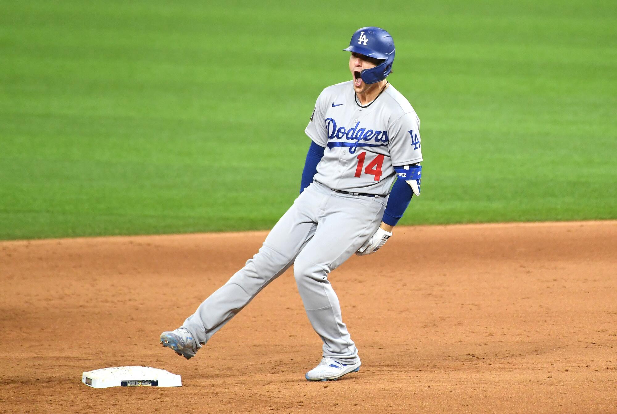 Dodgers second baseman Kiké Hernández celebrates after hitting a two-run double in the sixth inning.