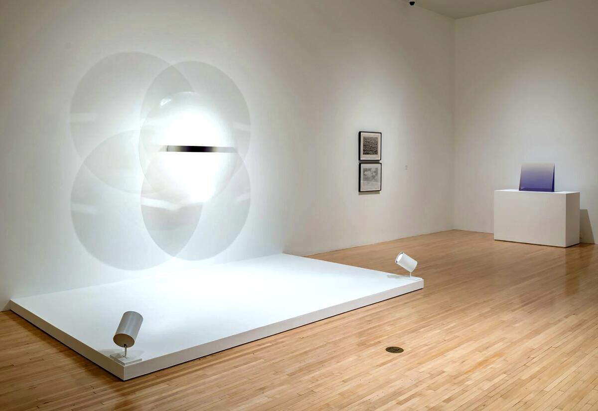 Sculptures and drawings by Robert Irwin, Vija Celmins and Peter Alexander in a museum gallery