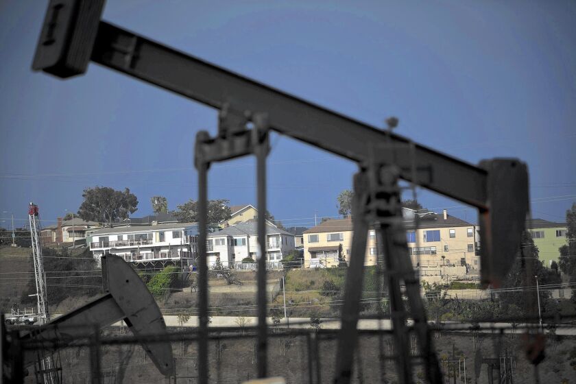 Homes overlook the Inglewood Oil Field. A new state law requires oil and gas companies to report the amount of water used in drilling operations that involve hydraulic fracturing, or fracking.