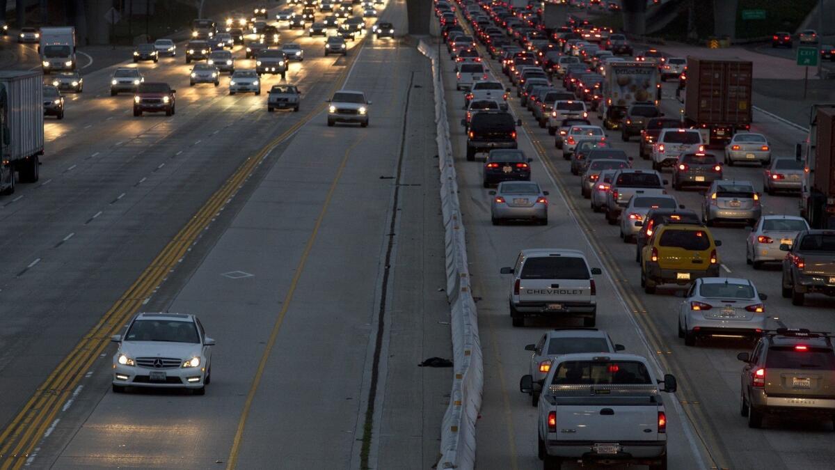 Motorists travel on the 405 Freeway through Costa Mesa, where demolition and reconstruction of the Fairview Road bridge over the freeway is scheduled to start in late February or early March.