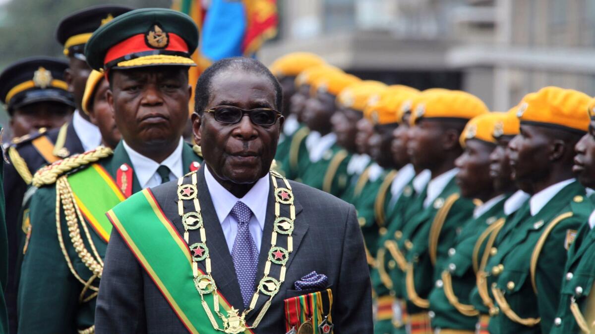 Zimbabwe's President Robert Mugabe inspects the guard of honor in Harare on Oct. 6, 2009.