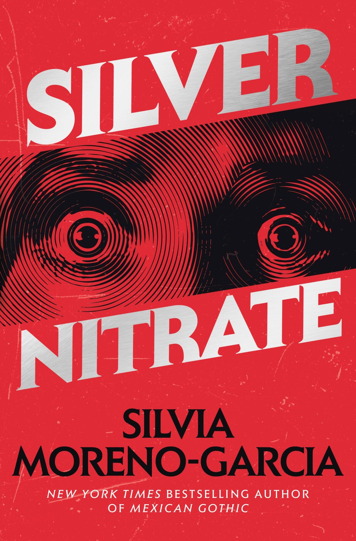 book cover for 'Silver Nitrate' by Silvia Moreno-Garcia features eyes wide open on red frontground