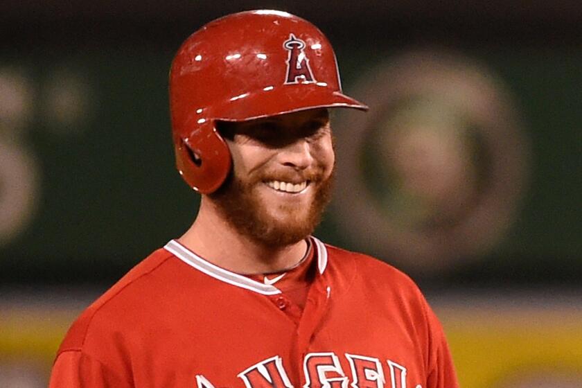 Angels outfielder Josh Hamilton smiles while standing at second base during a game against the Oakland Athletics on Aug. 28.