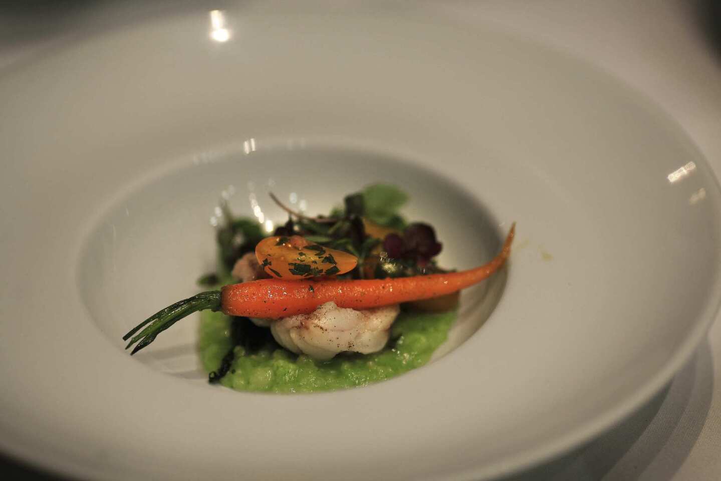 Monkfish, served with cannabisepazote pesto, congee, nettles shiso and young carrots, was one of several dishes served to about 40 guests during a "Weed+Chinese Herb" dinner at an undisclosed location on Sunday evening.