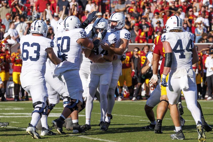 LOS ANGELES, CA - OCTOBER 12, 2024: Teammates swarm Penn State Nittany Lions.