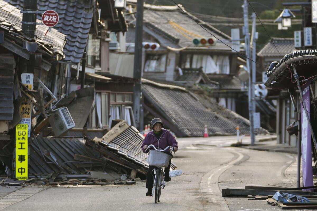 AP Photos Search presses on for earthquake survivors as Japan grieves