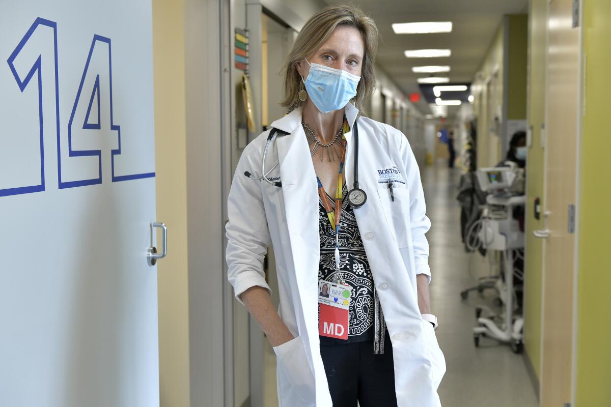 Dr. Katherine Gergen Barnett in a hospital corridor.