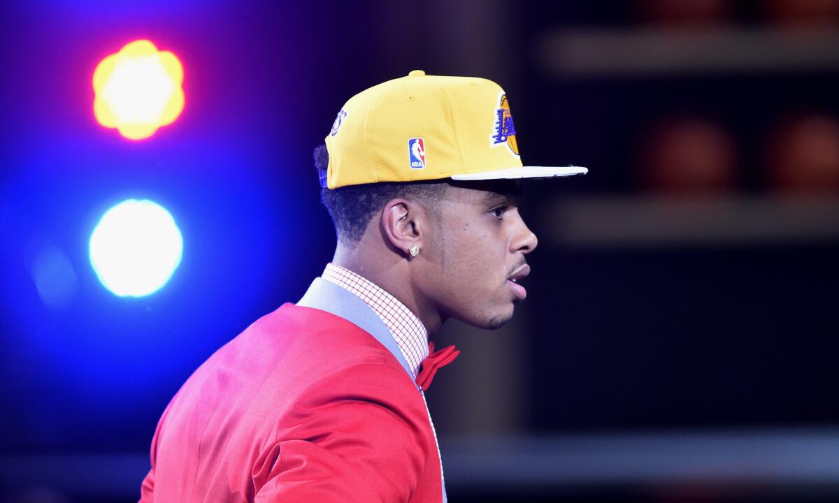 Ohio State guard D'Angelo Russell walks to the stage after being selected with the No. 2 overall pick in the 2015 NBA Draft by the Lakers on Thursday at Barclays Center in Brooklyn, N.Y.