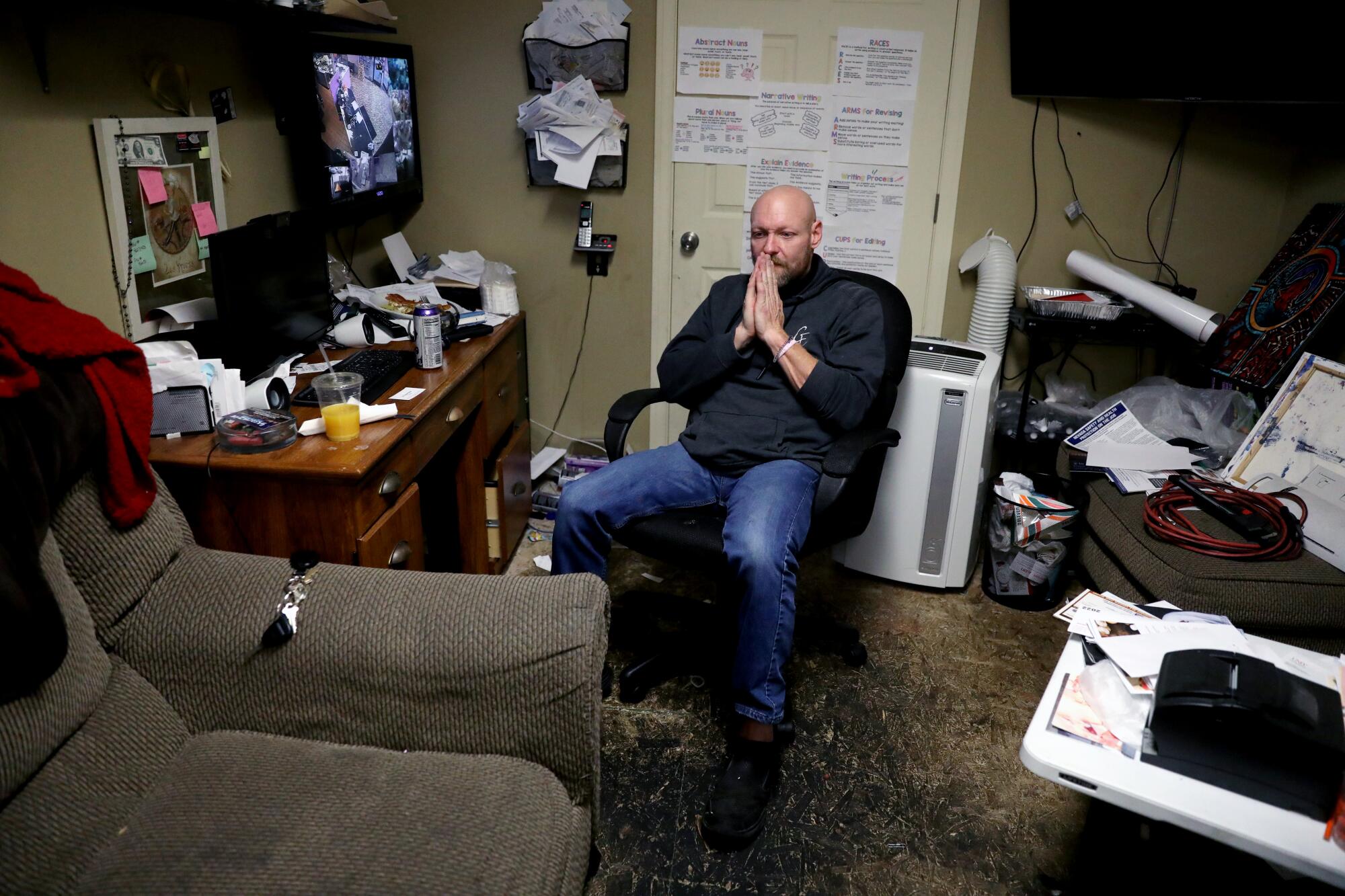 Lou Remillard sits in his office