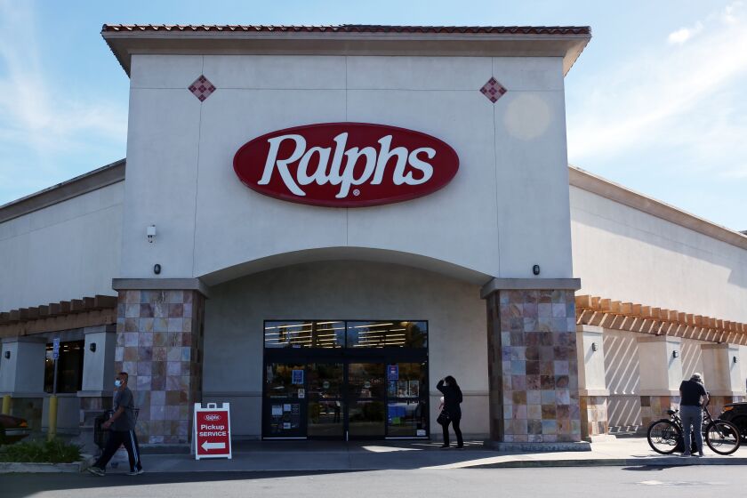 LONG BEACH, CA - FEBRUARY 02: People enter and exit a Ralphs store which Kroger, its parent company will shut down in response to the city imposing a "hero pay" increase of 4 dollars per house in on Tuesday, Feb. 2, 2021 in Long Beach, CA. The Ralphs is located at 3380 N. Los Coyotes Diagonal. (Dania Maxwell / Los Angeles Times)
