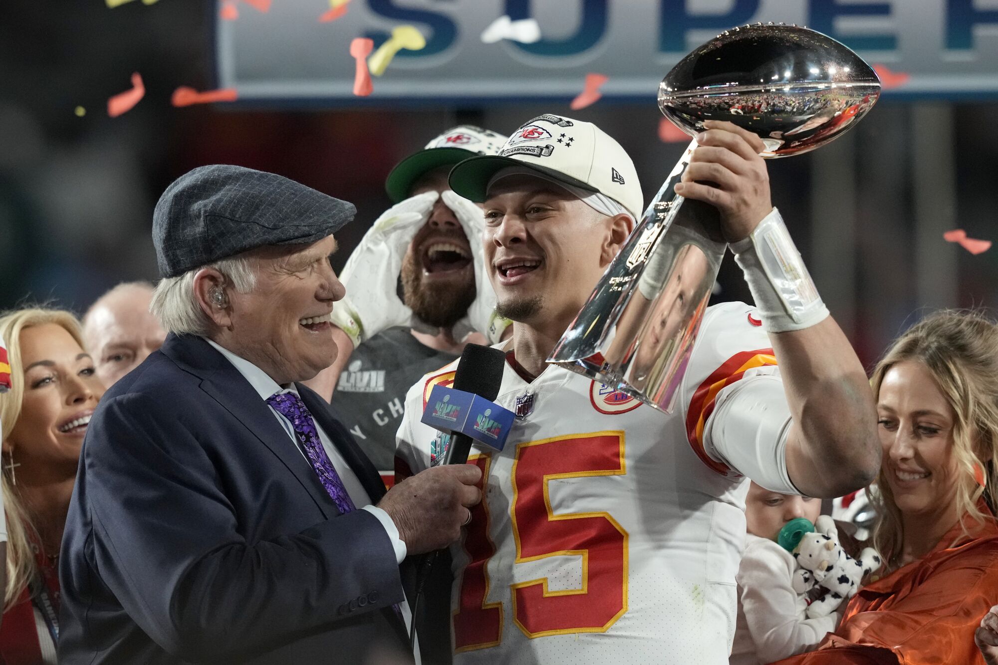 Kansas City quarterback Patrick Mahomes holds the Vince Lombardi Trophy as he is interviewed by Terry Bradshaw.
