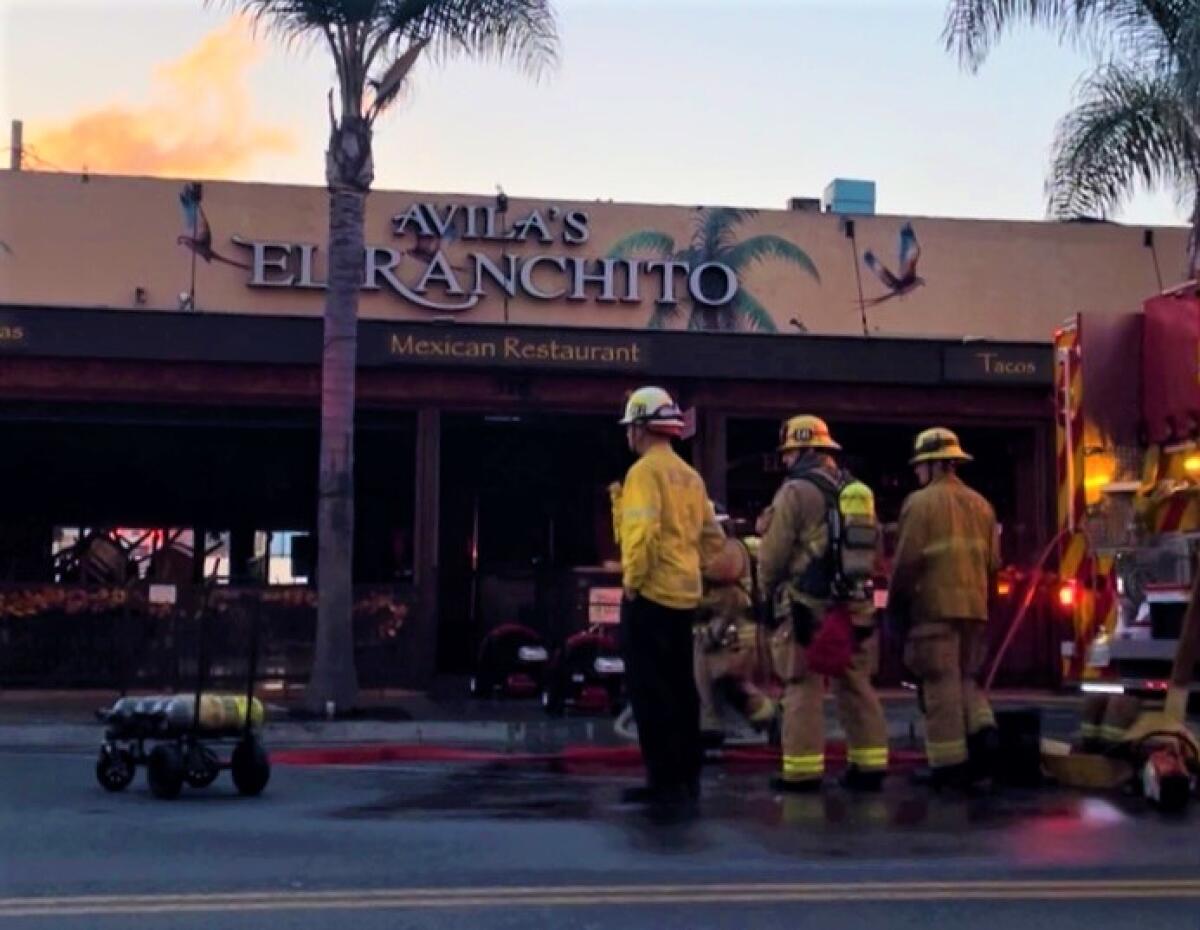 Firefighters respond to an early  morning kitchen fire at Avila's El Ranchito in Downtown Huntington Beach.