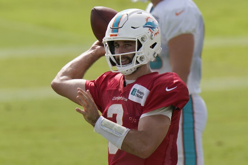 Miami Dolphins quarterback Josh Rosen (3) looks to pass during practice at the NFL football team's training facility.