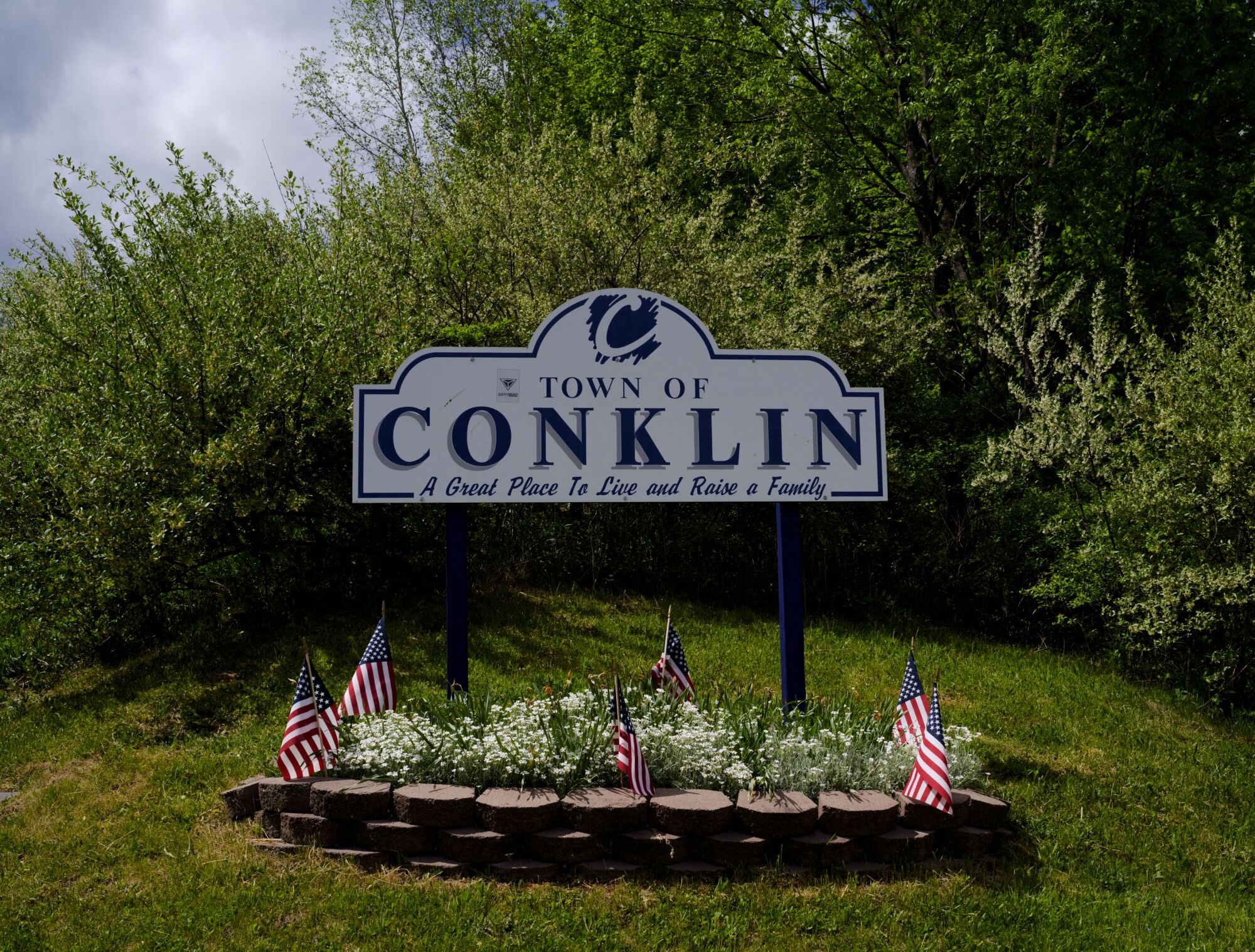 An outdoor sign says "Town of Conklin."