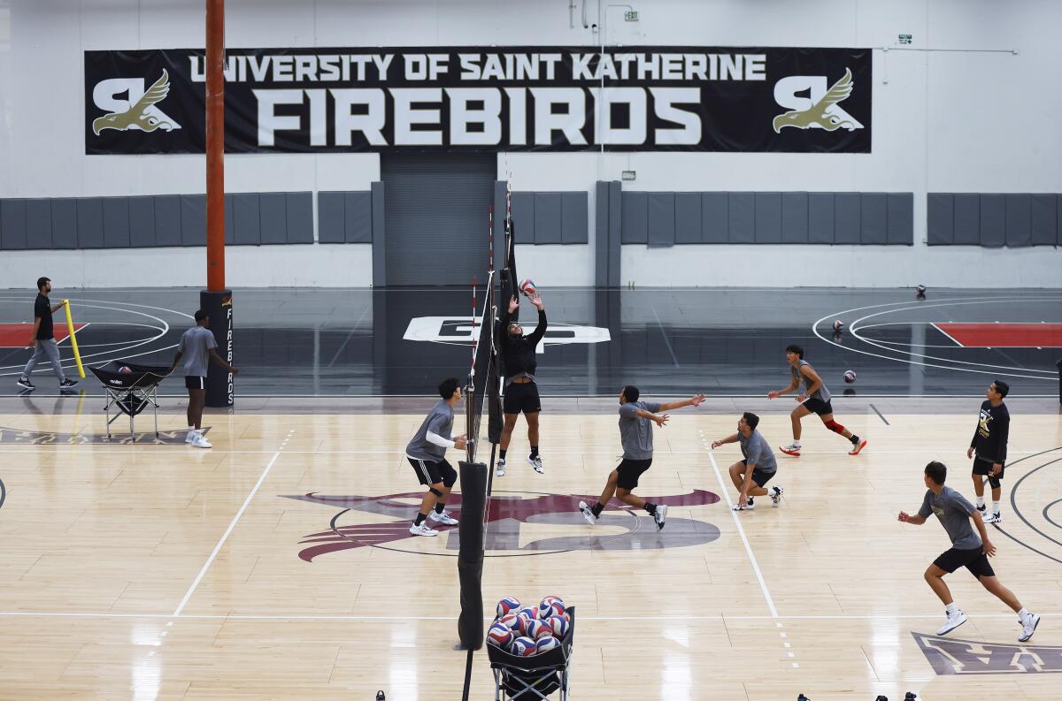 The University of Saint Katherine men's volleyball team practices at the school's San Marcos gym in 2022.