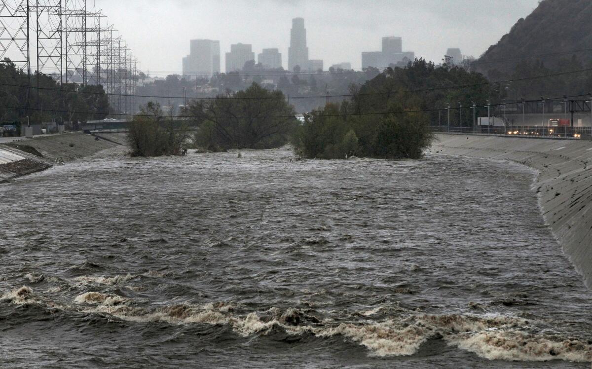 Water from a storm flows down the Los Angeles River on Feb. 28, 2014.