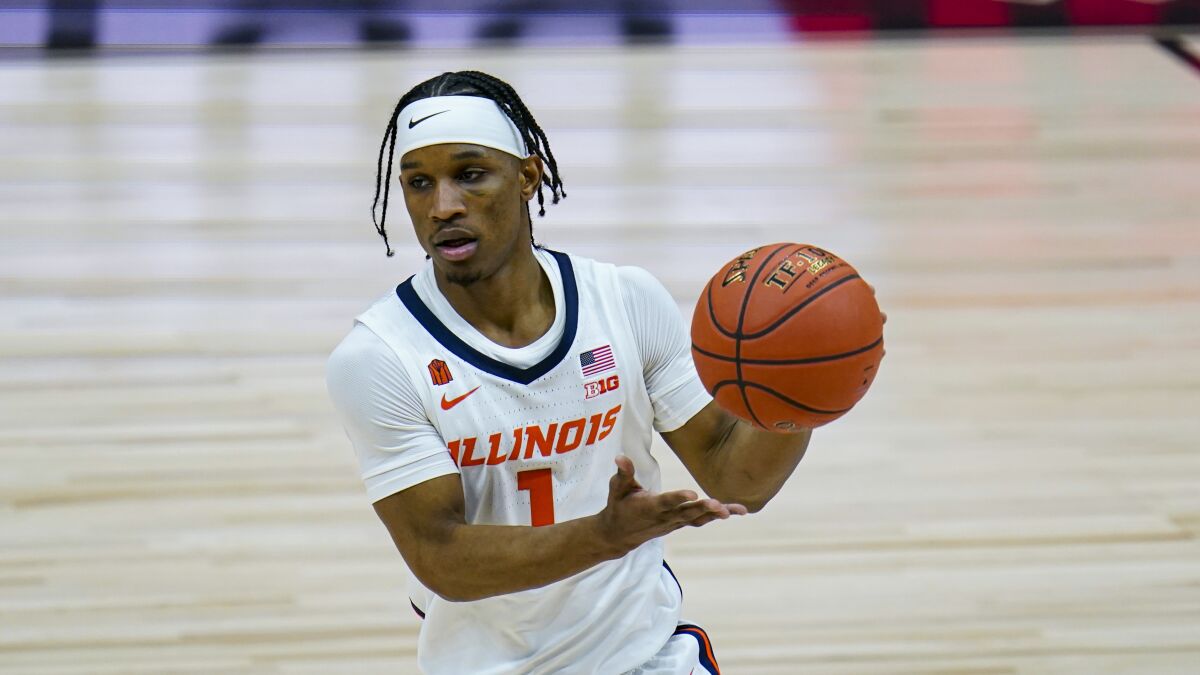 Illinois guard Trent Frazier controls the ball against Rutgers during Big Ten tournament on Friday.
