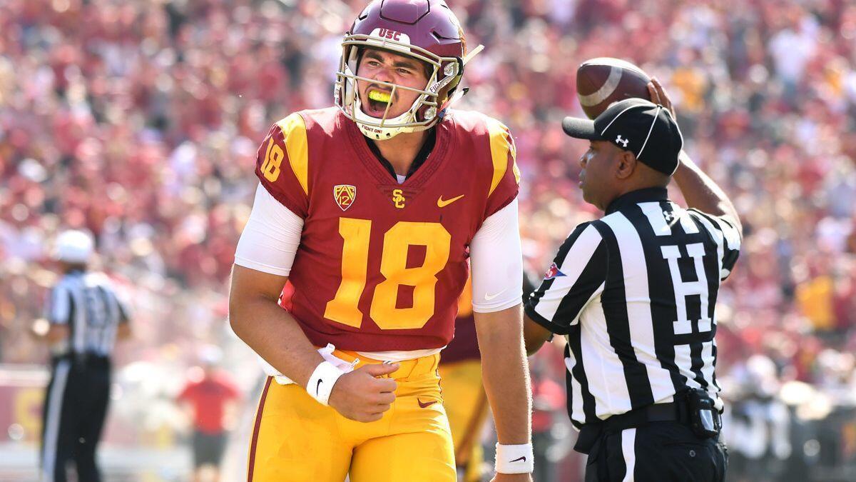 USC quarterback JT Daniels celebrates his first touchdown pass against Nevada Las Vegas in the fourth quarter at the Coliseum on Saturday.