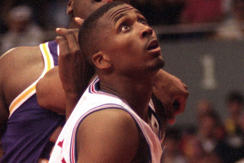 The Clippers' center Lorenzen Wright had his hands full with the Lakers' Shaquille O'Neal as the Clipper rookie gave up a couple inches in height and 75 lbs. to the Laker center.Mandatory Credit: Vince Compagnone/The LA Times