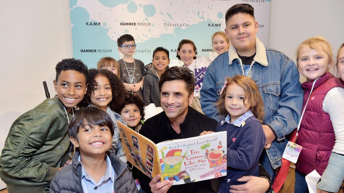 John Stamos and kids attend the Hammer Museum K.A.M.P. event May 19 in Los Angeles.