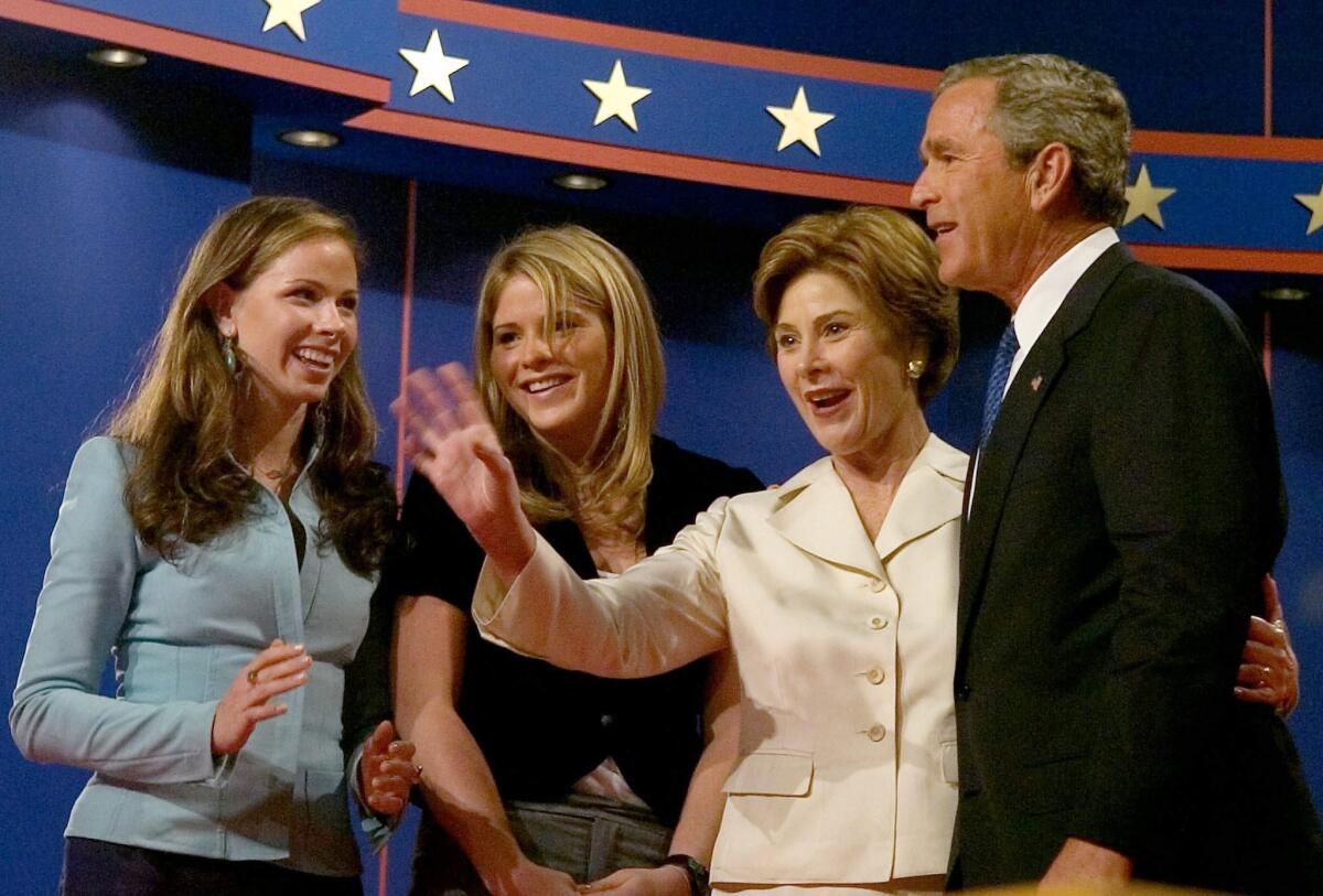 President George W. Bush and First Lady Laura Bush with Jenna, left, and Barbara Bush after the first televised debate presidential debate of 2004.