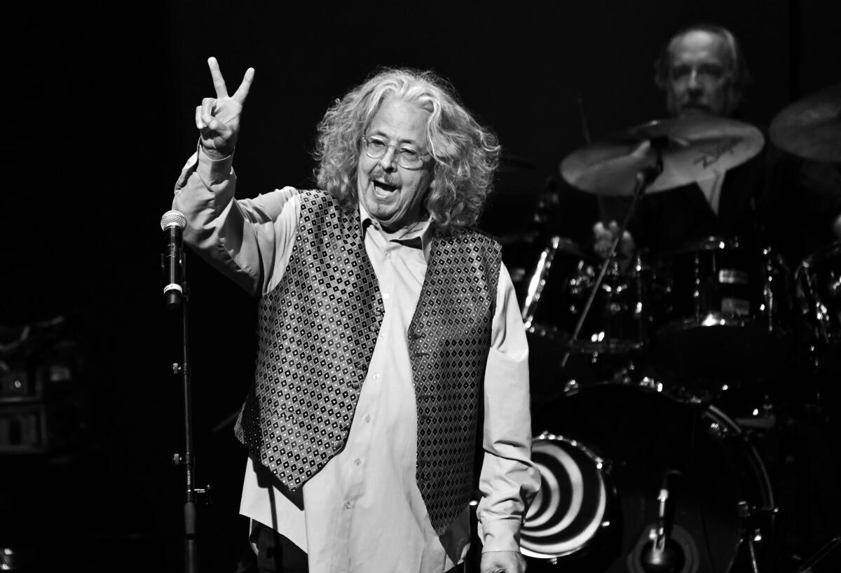 The rock singer clarifies the peace sign