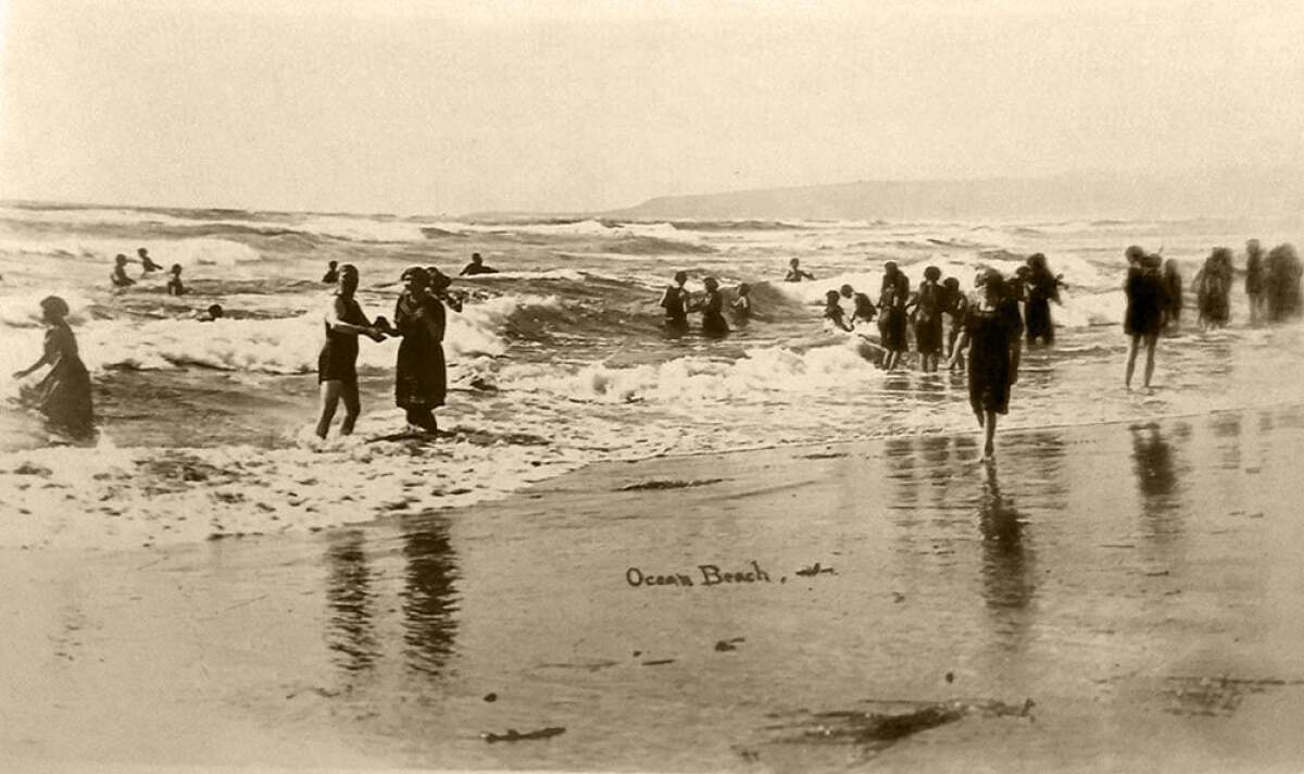 Ocean Beach surf bathers frolic on a calm day in this undated photo from the 1910s.