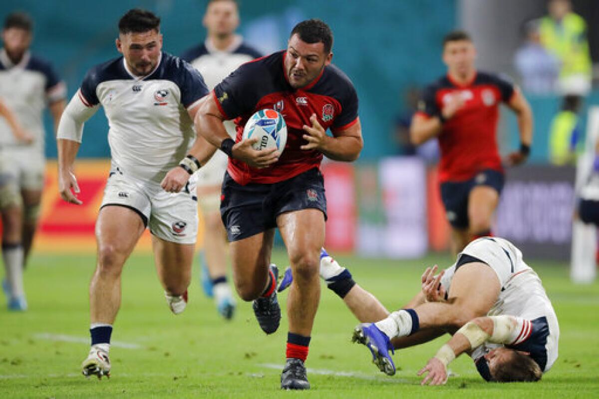 England's Ellis Genge runs against the United States during a 2019 Rugby World Cup match played in Kobe, Japan.