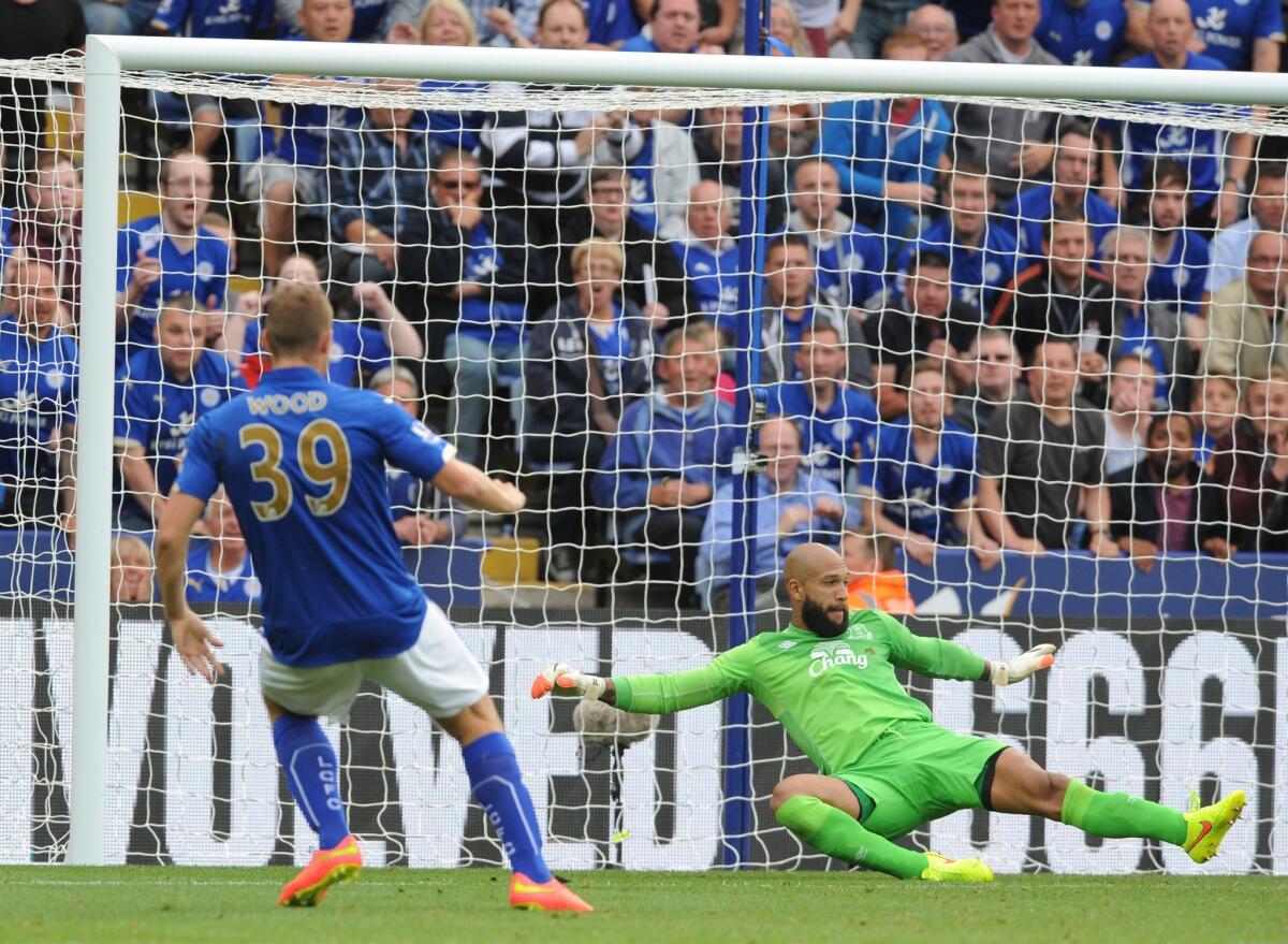 Everton's Tim Howard, right, can't stop Leicester's Chris Wood from scoring in an English Premier League game Aug 16. The American Howard is taking a break from international soccer and will not be considered for selection to the U.S. national team until September 2015