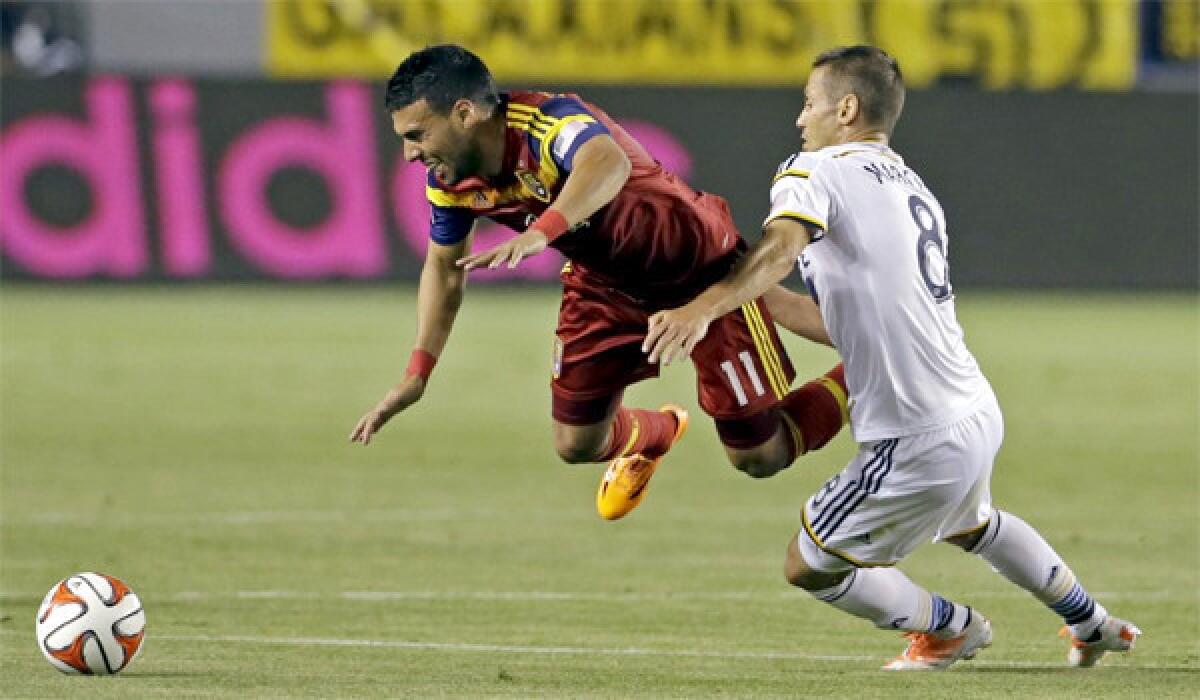 Galaxy midfielder Marcelo Sarvas steps in front of Real Salt Lake's Javier Morales during L.A.'s season-opening loss, 1-0, at StubHub Center on Saturday.
