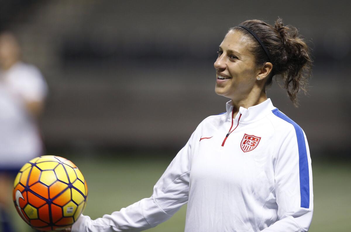 U.S. midfielder Carli Lloyd smiles during a practice session for the team's international soccer friendly against China in New Orleans on Dec. 15.