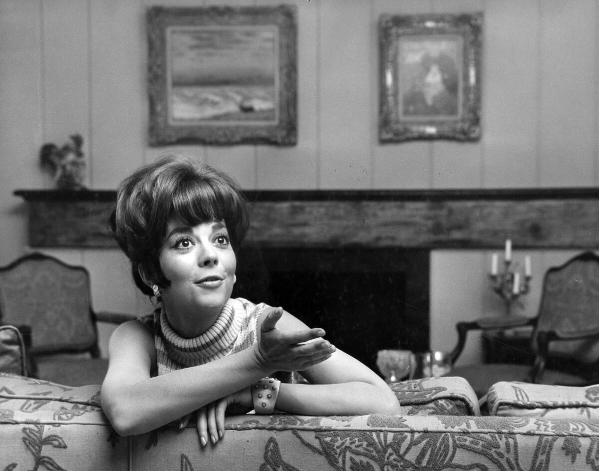 Natalie Wood in a scene in a living room in the 1966 movie "Penelope"