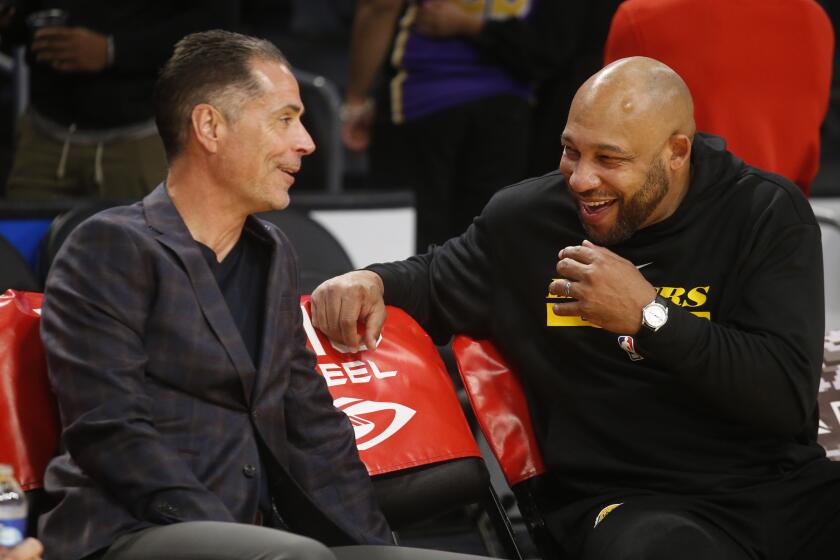 FILE - Los Angeles Lakers coach Darvin Ham, right, talks with general manager Rob Pelinka.